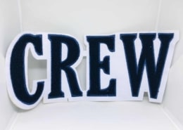 white fabric chenille letter patch C R E W for navy blue yarn