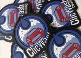 round shape blue , black and whit text silicone badge spread over