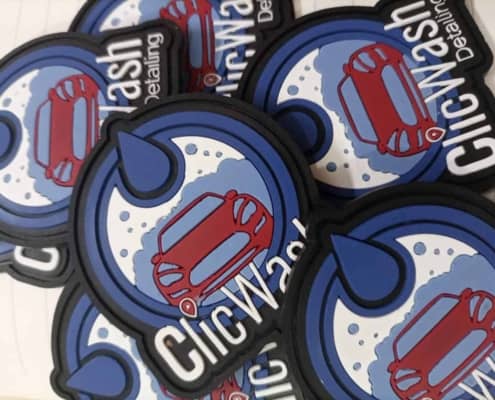 round shape blue , black and whit text silicone badge spread over