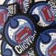 round shape blue , black and whit text silicone badge spread over